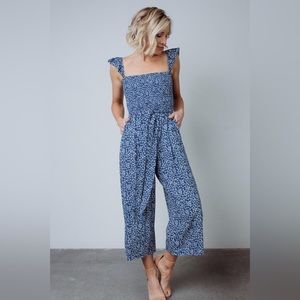 Vintage style flower print jumpsuit with wide leg cropped pant and pockets
